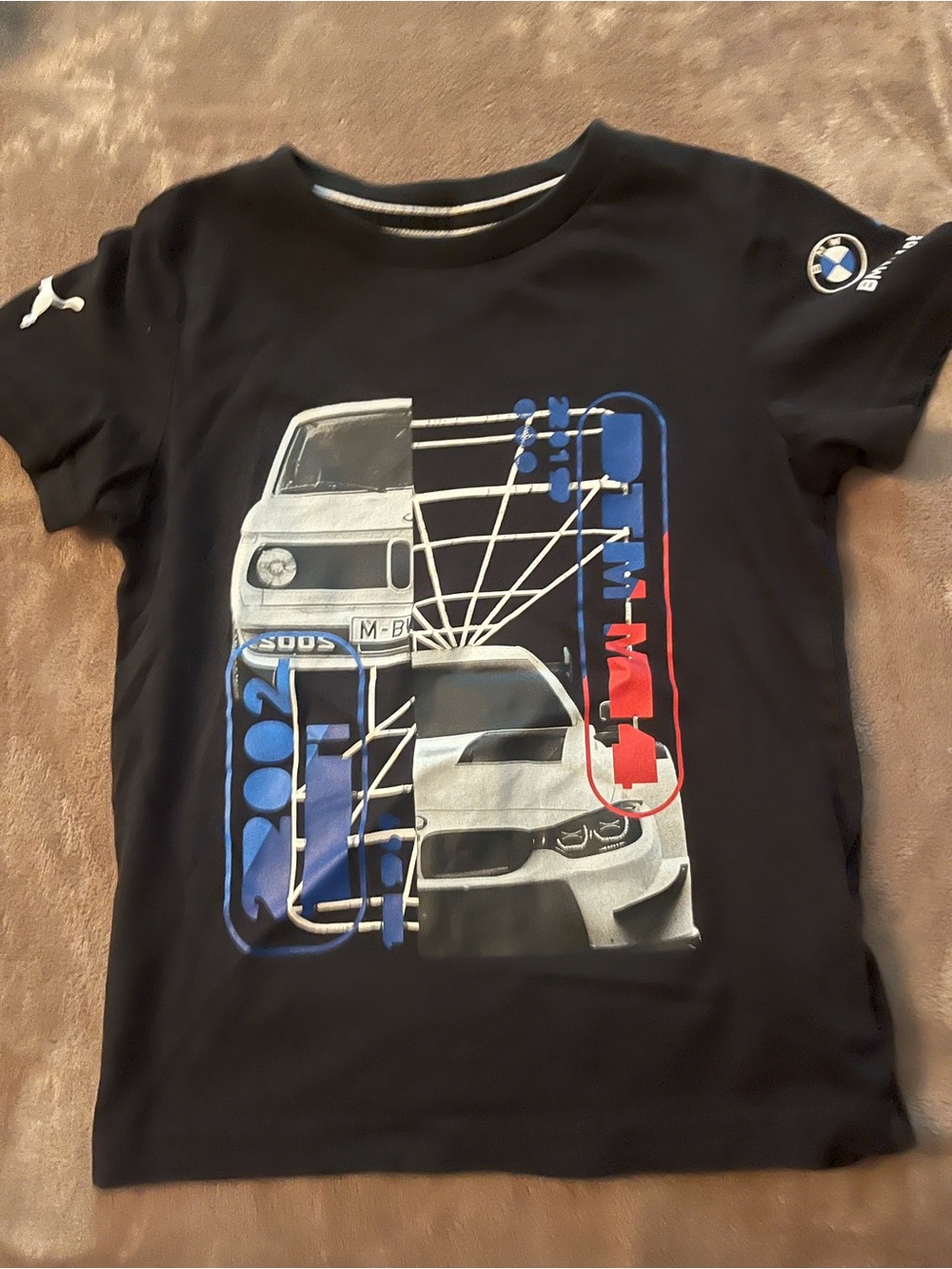 Puma Black Kids Graphic Tee with Blue and Red Accents
